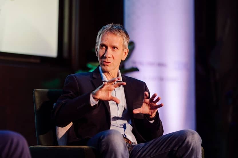Jeff Crume seated on stage answering a question during a panel at the INCYBER Forum in Montréal
